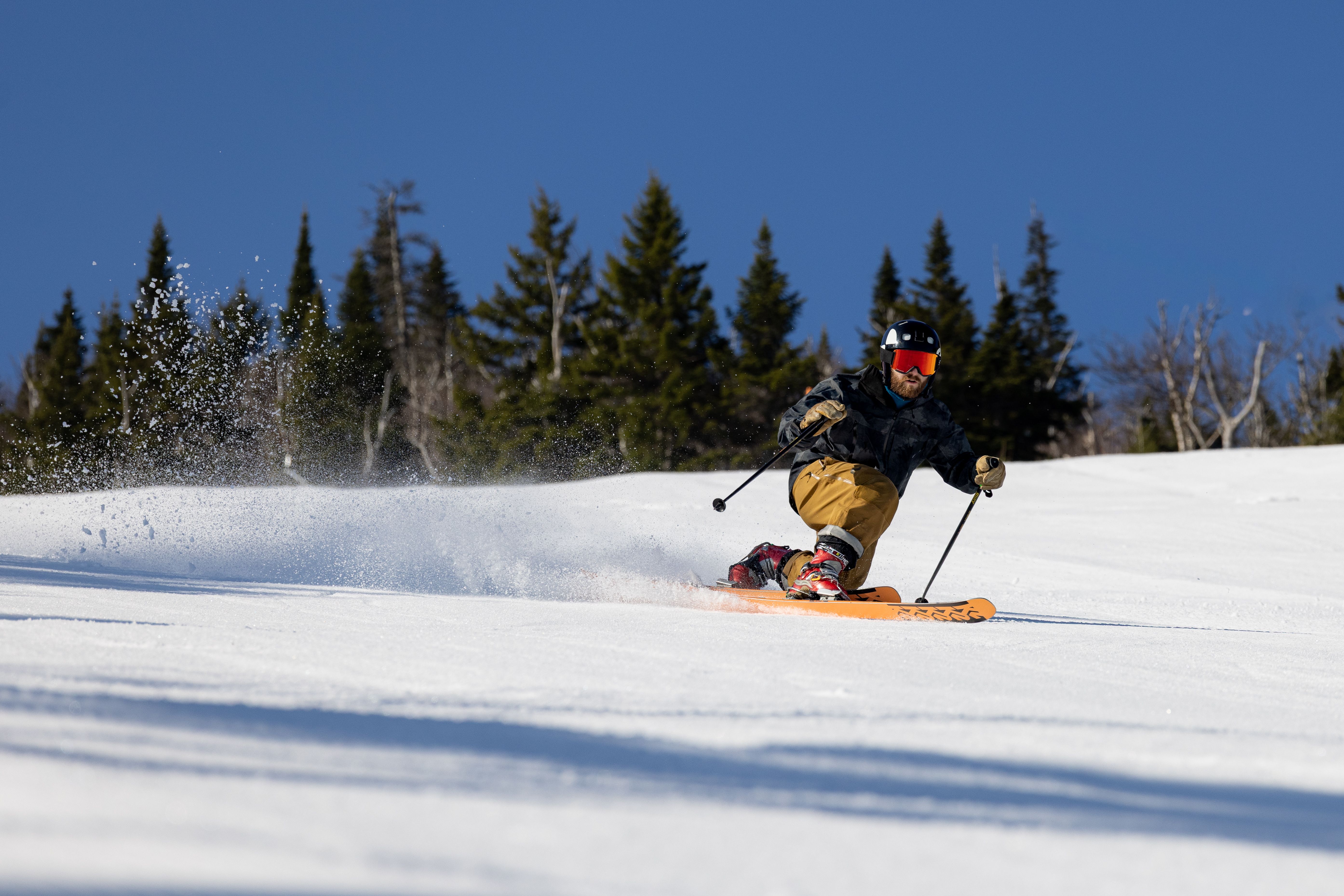Spring skier with bluebird skies