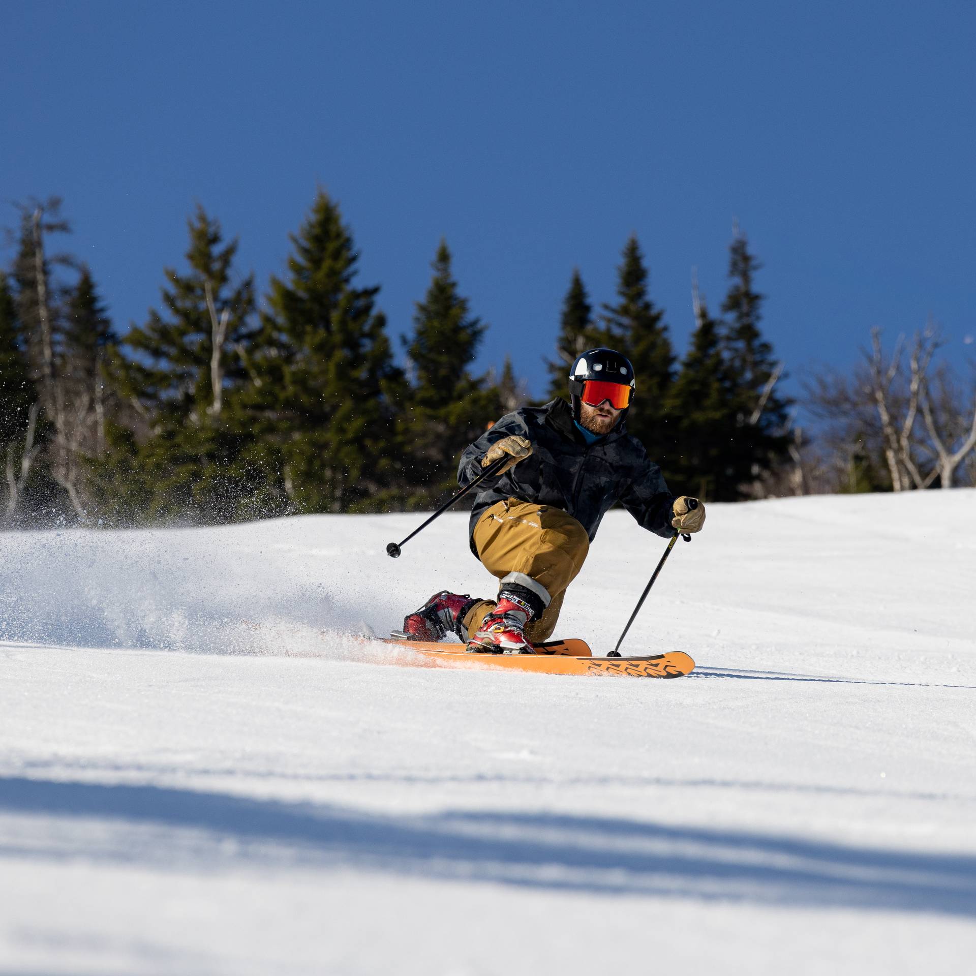 Spring skier with bluebird skies
