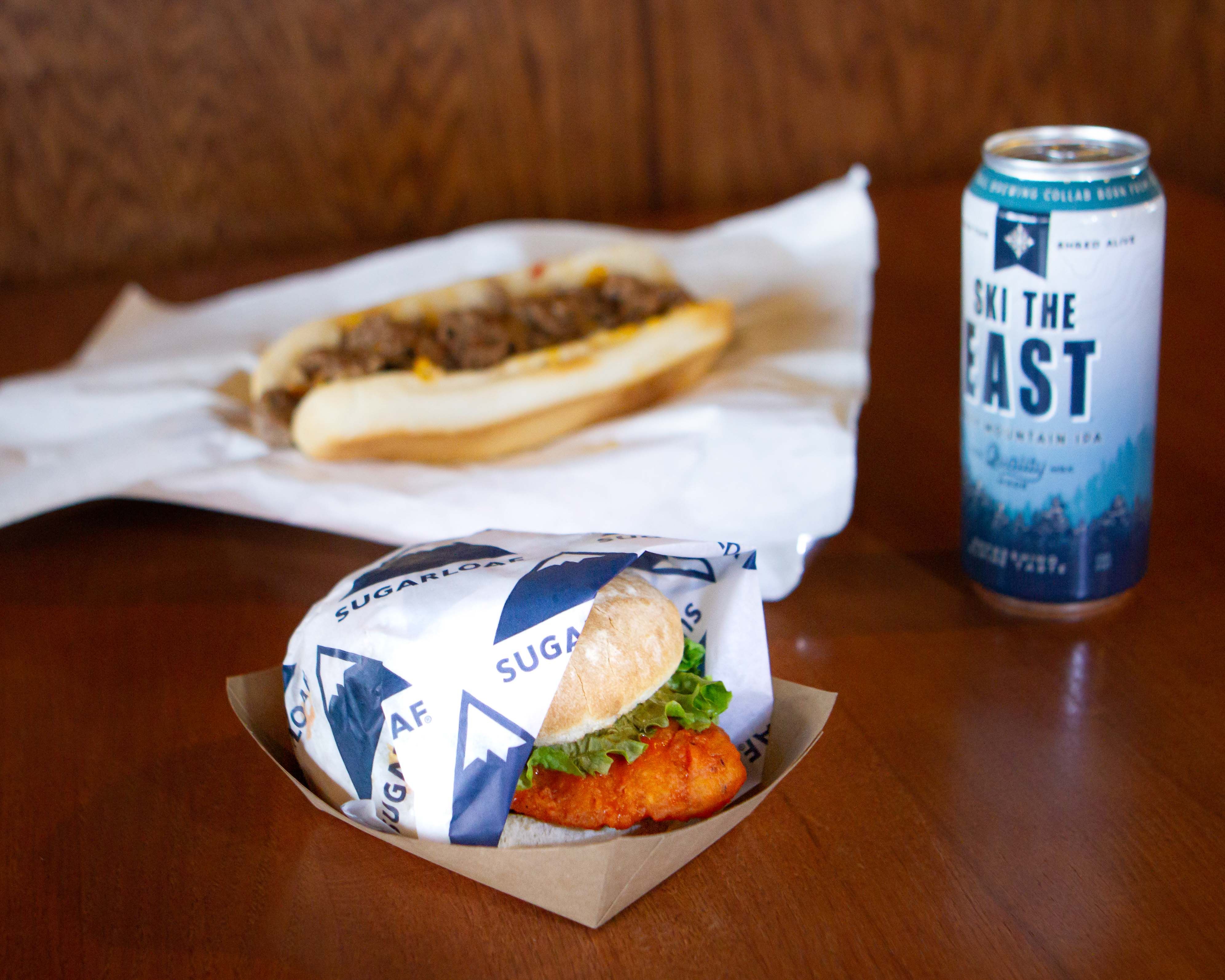 Narrow Gauge lunch featuring a hamburger, chili dog, and Ski the East beer