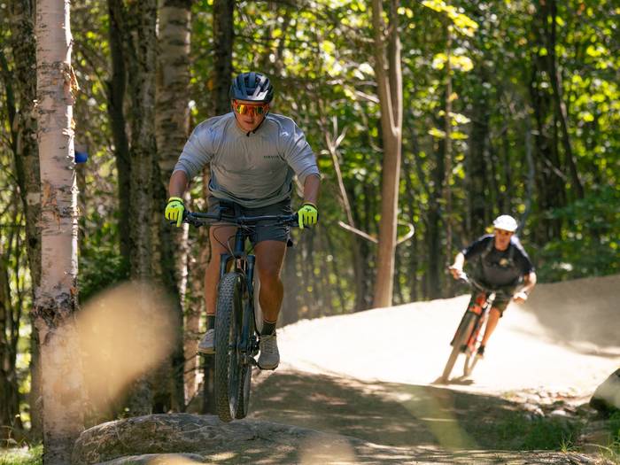 Two bikers on trail