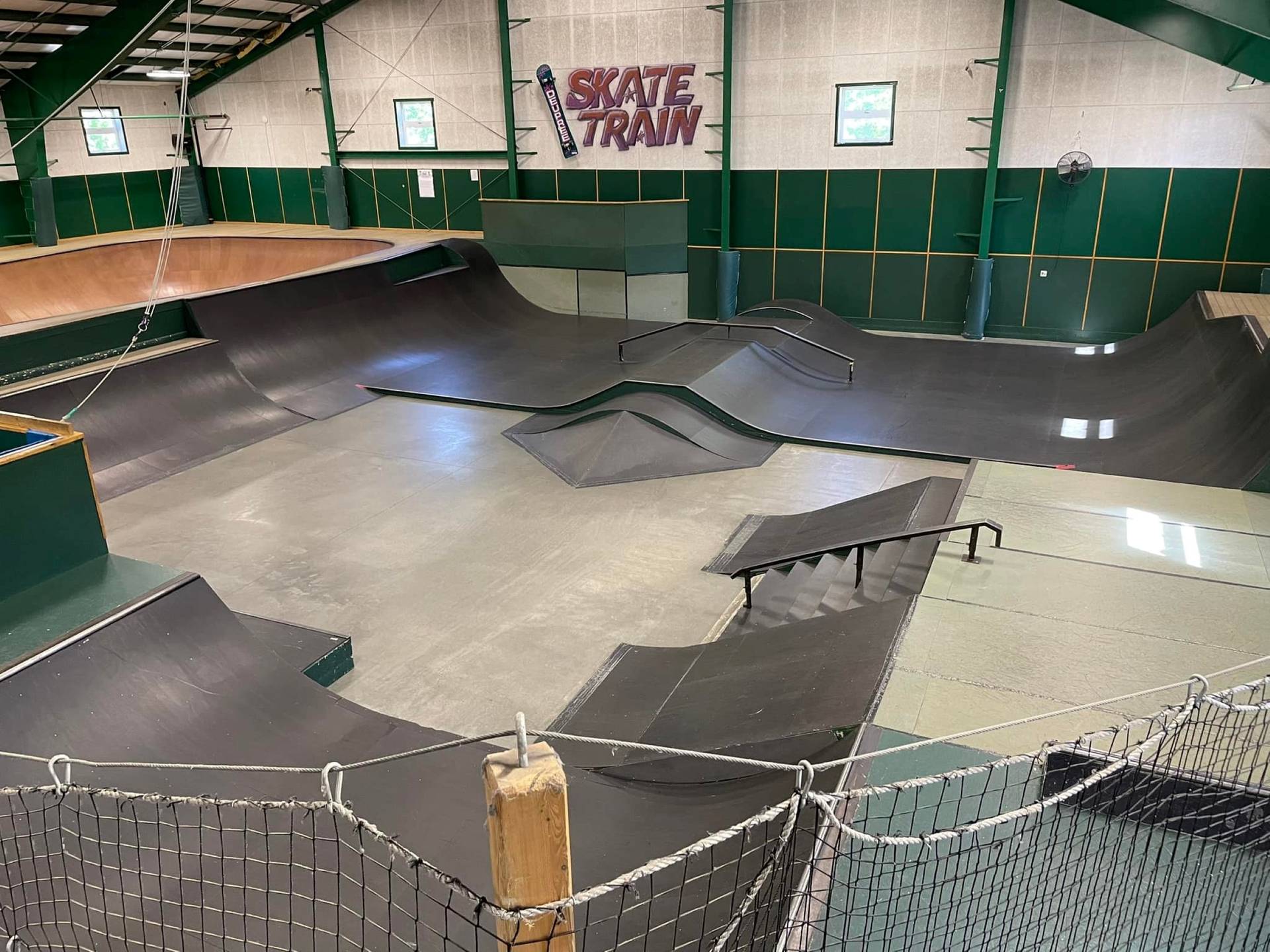 Skate park area complete with ramps, rails, and potential