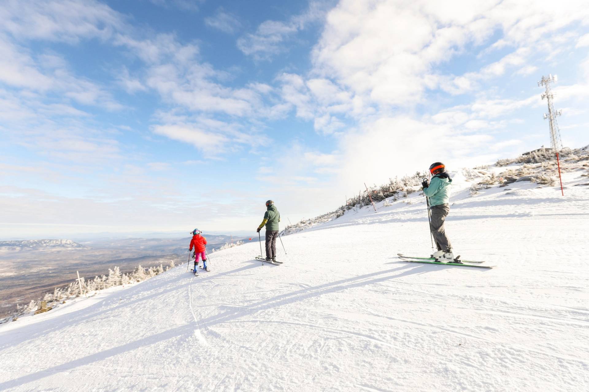 skiers on groomed trails