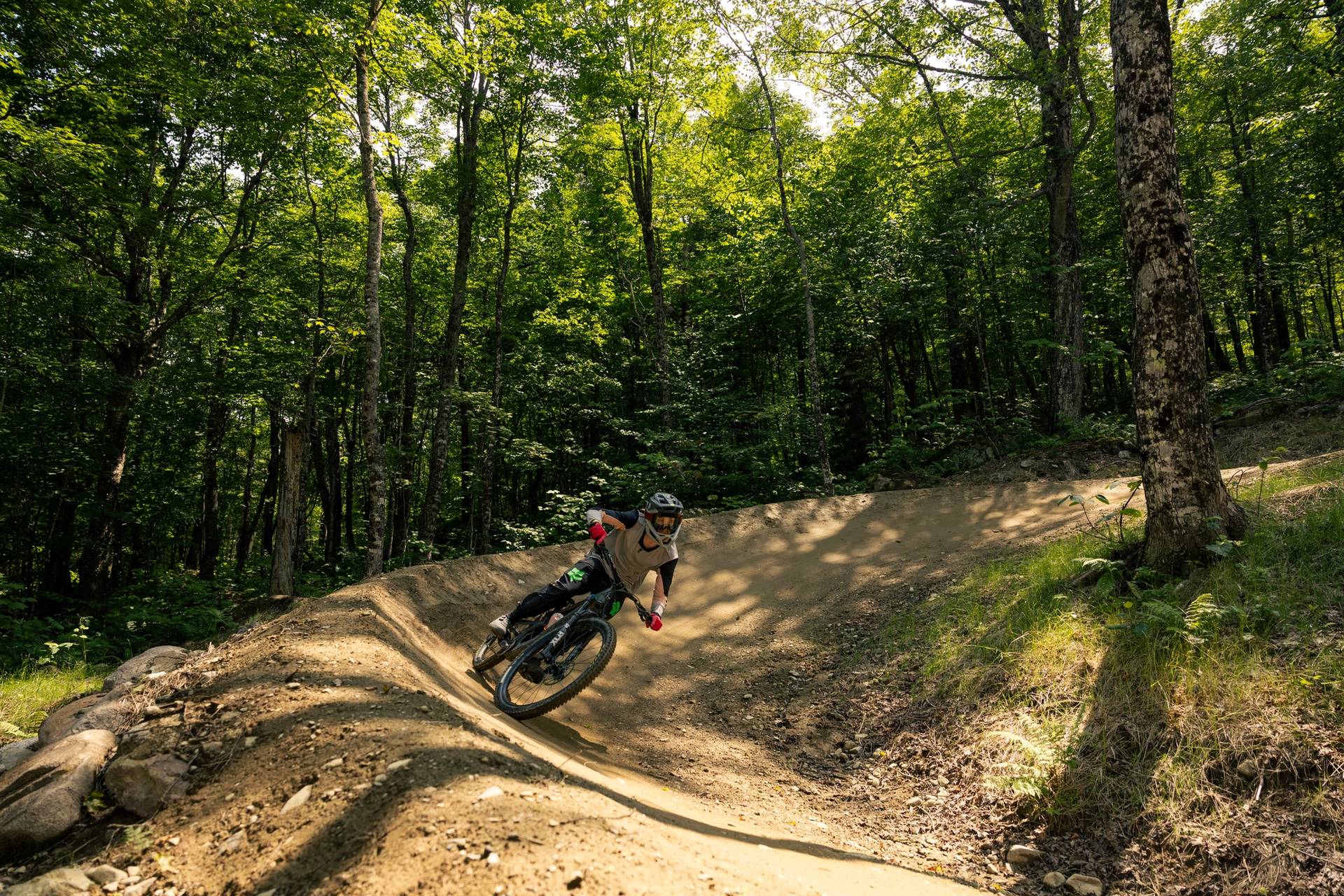 Mountain biker turns on a berm