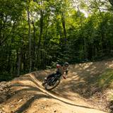 Biker making a turn on a burm