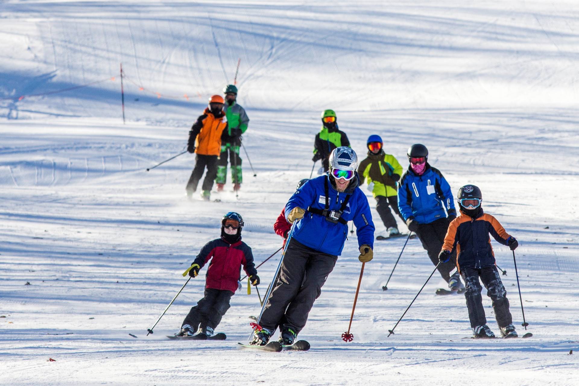 skiers following an instructor