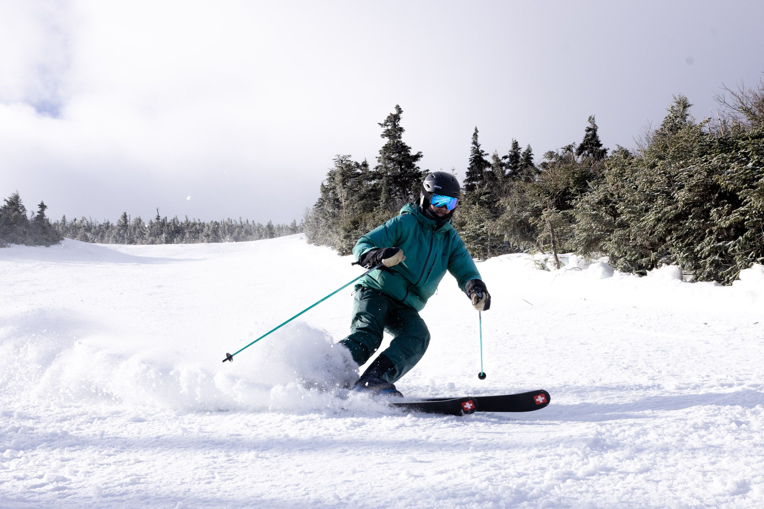 Skier in green jacket