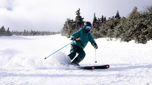 Skier in green jacket