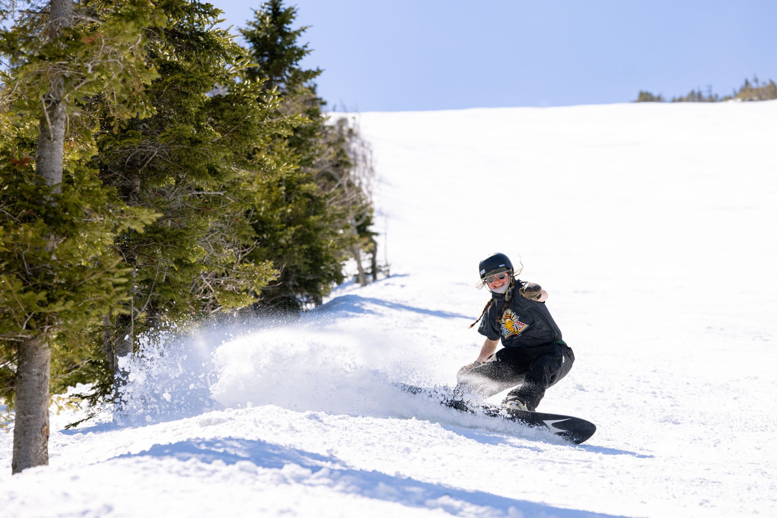 Spring skier on groomer