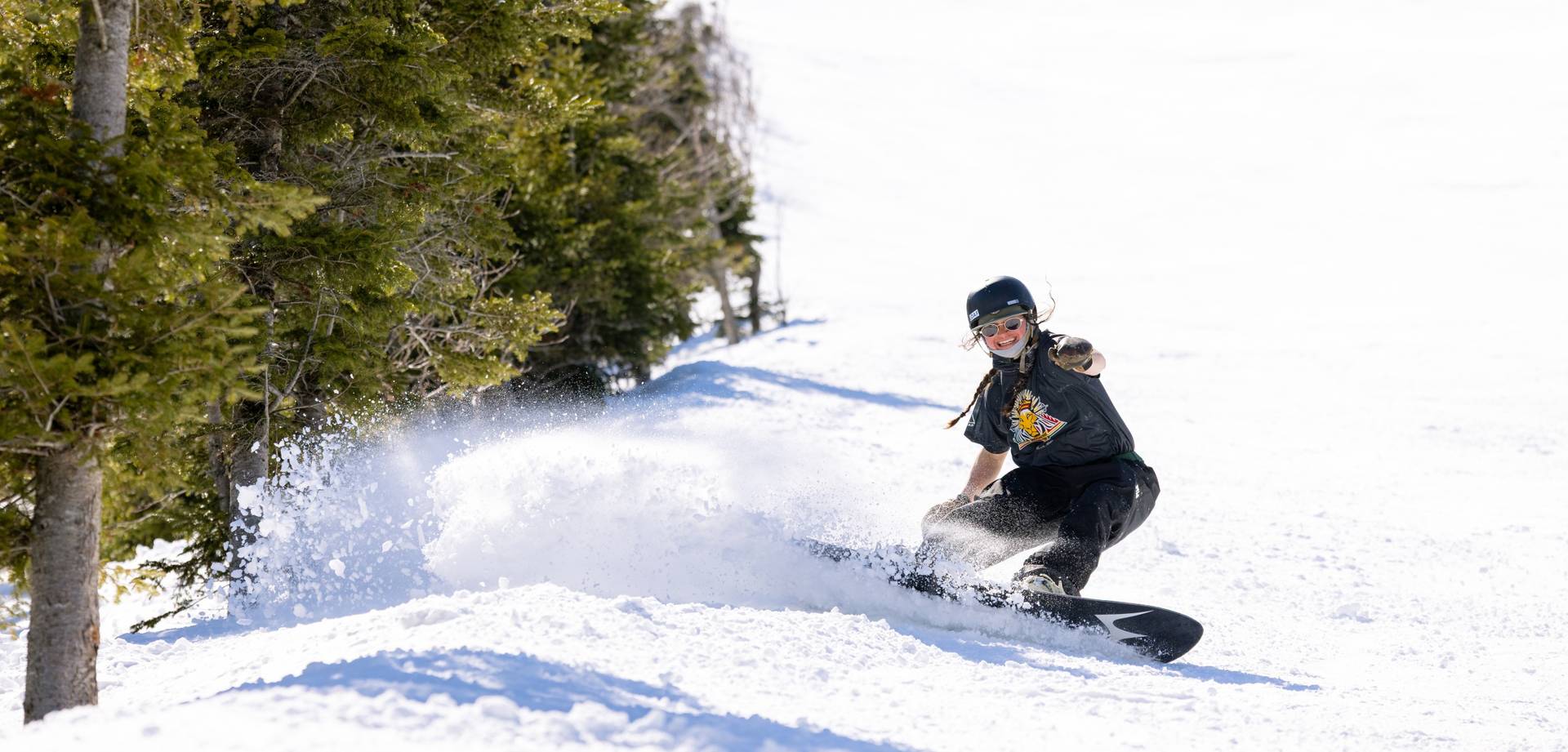 Spring skier on groomer