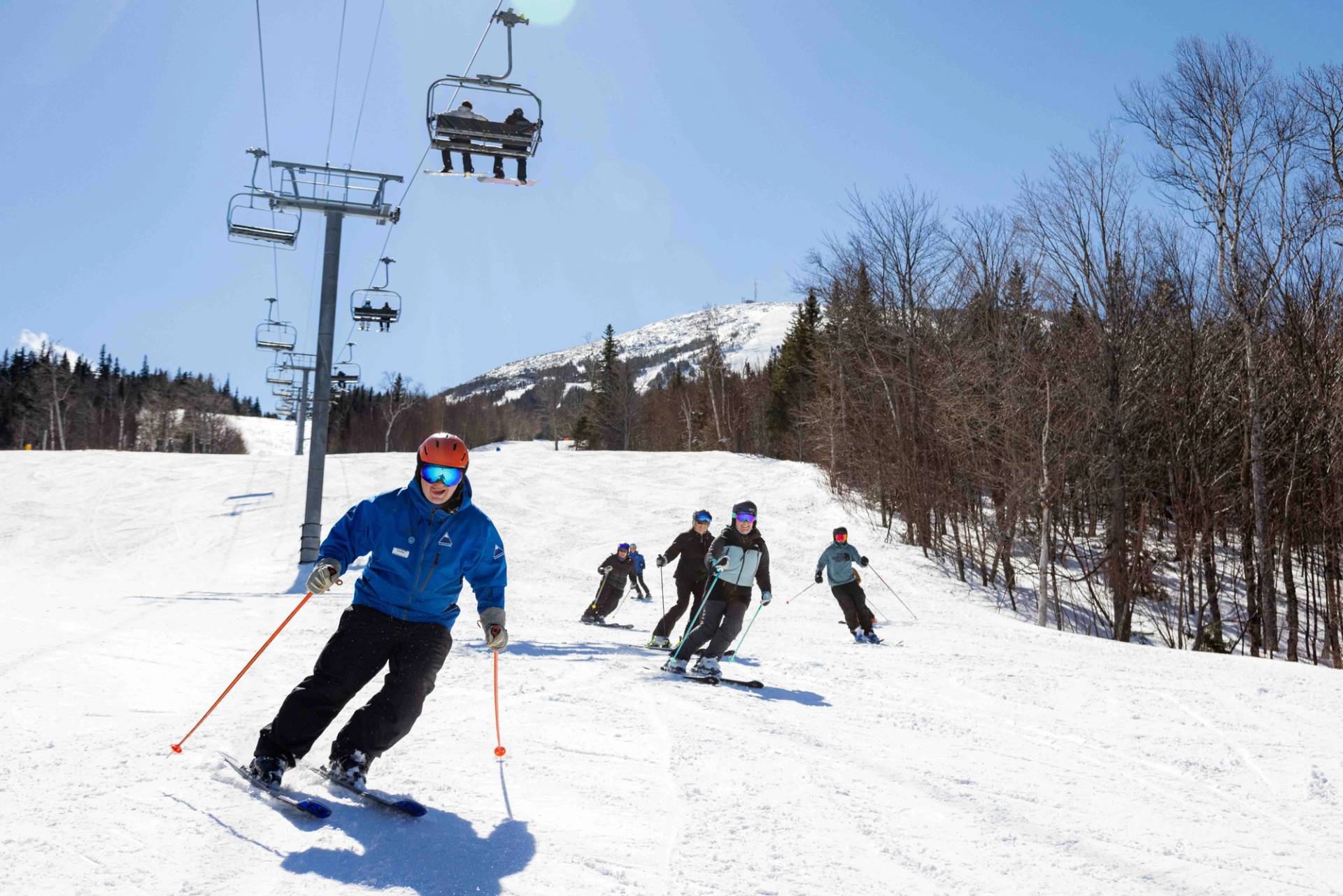 Instructor with adult ski group