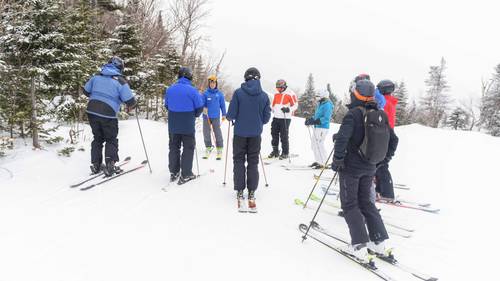 Ski lesson participants on snow