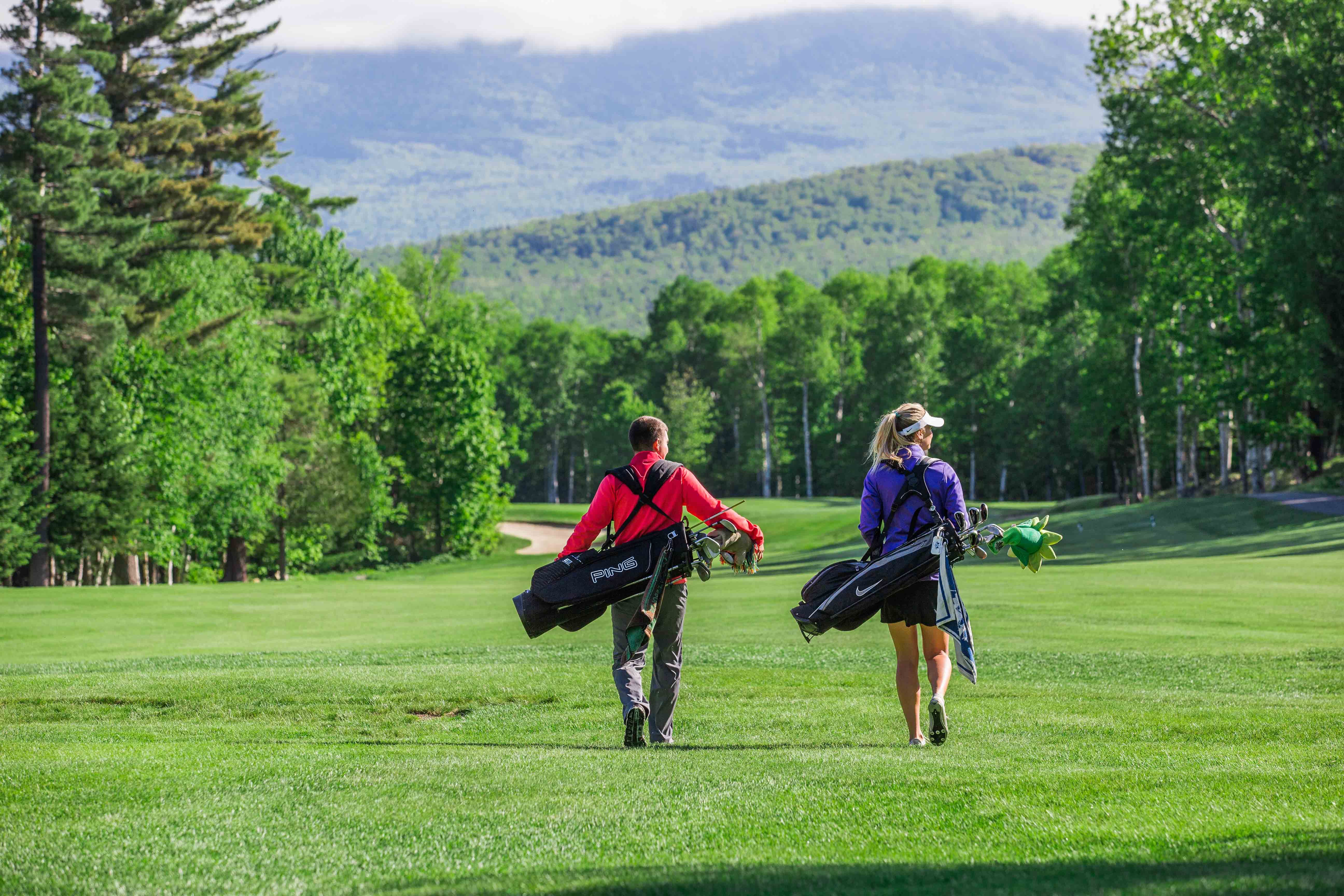 Golfer looking out over mountain vista