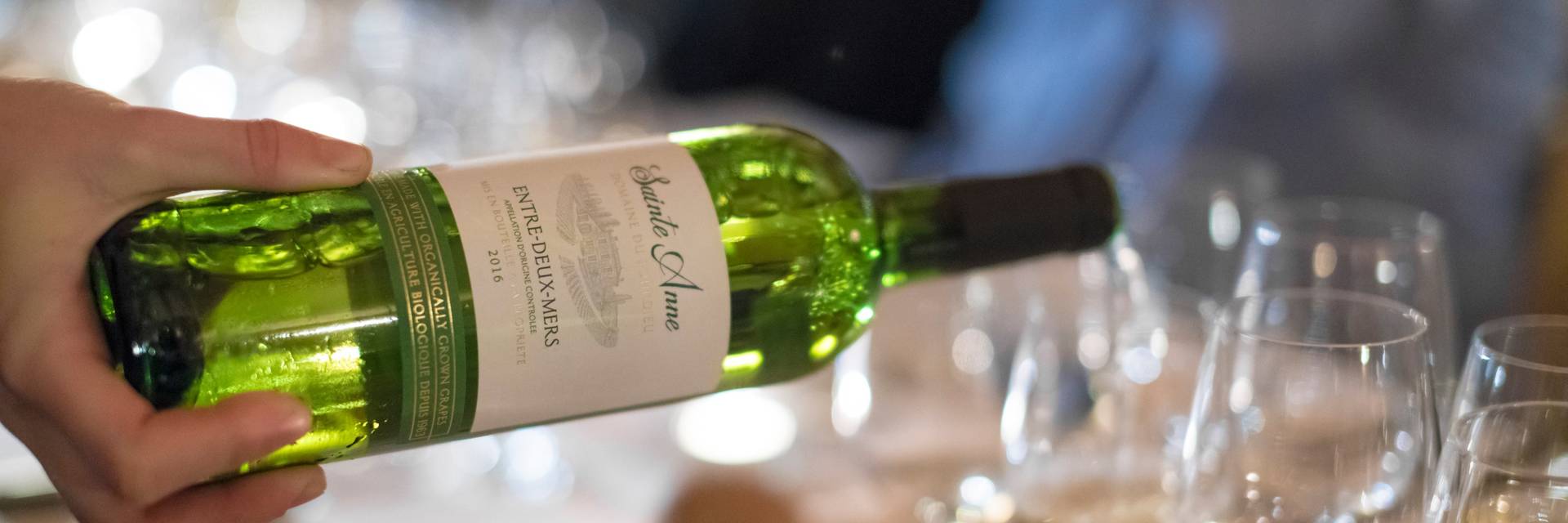 Server pouring a glass of wine