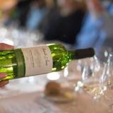 Server pouring a glass of wine