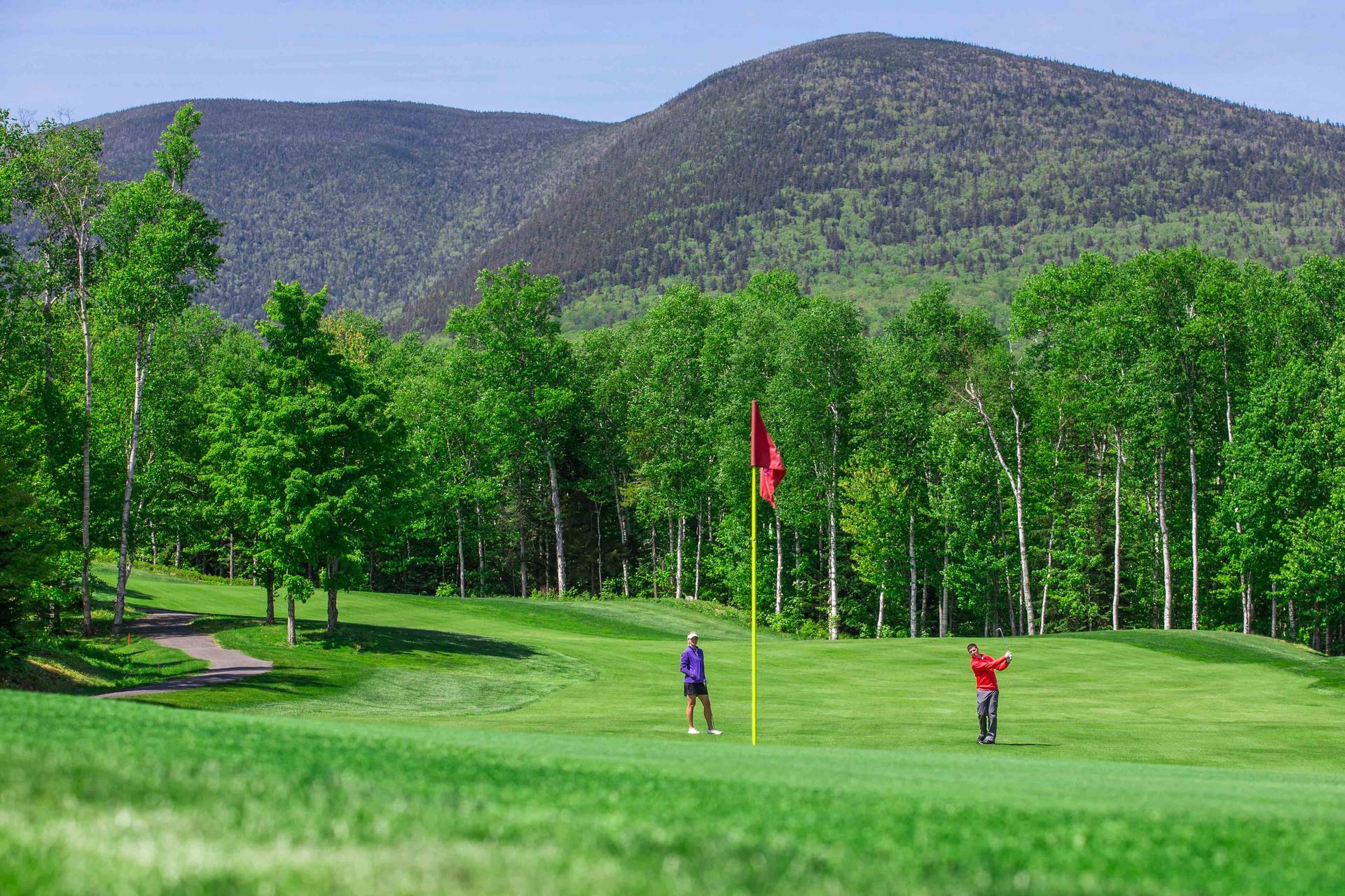 two golfers at a tee