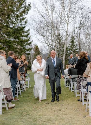 Bride and groom walking down the aisle