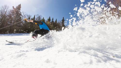 Skier in blue jacket