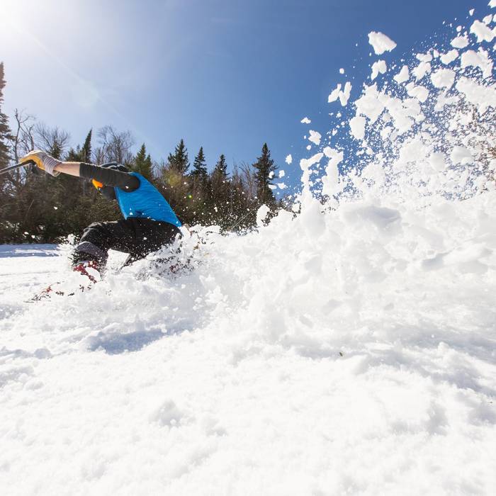 Skier in blue jacket