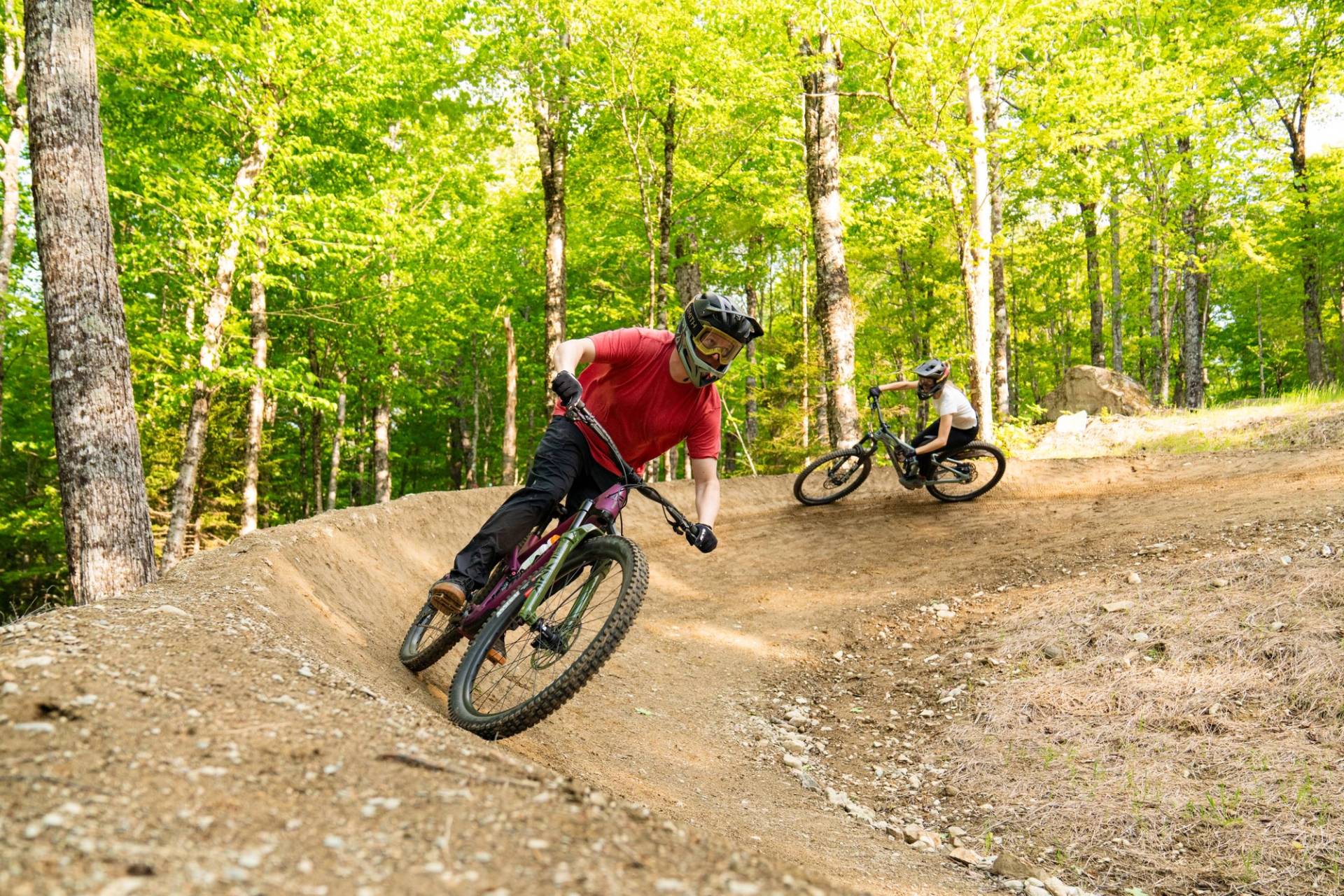 Mountain bikers on berm