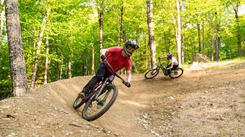 Mountain bikers on berm