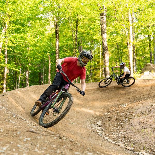 two mountain bikes on trail