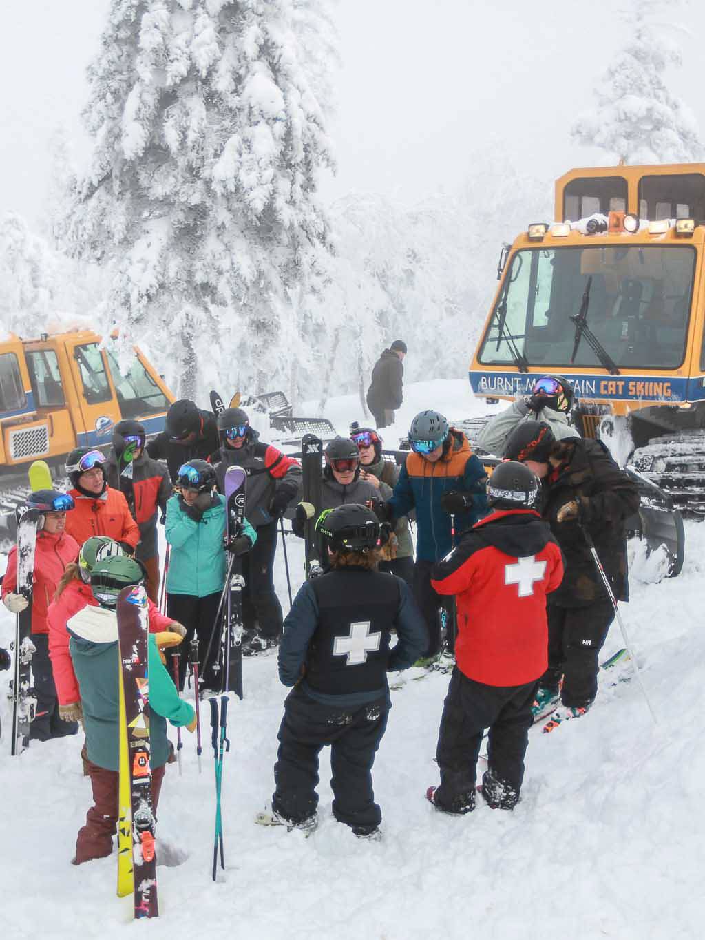 Cat skiers safety speech with ski patrol