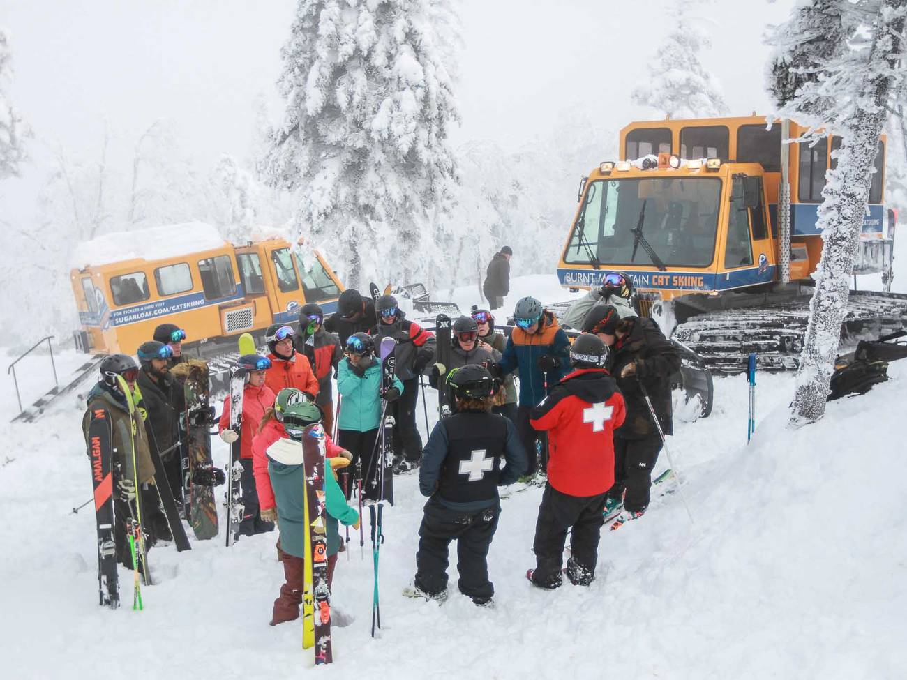 Ski Patrol Providing Safety Information at the Top of Burnt Mountain