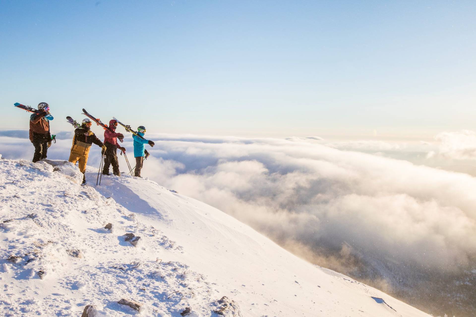 Skiers looking out over an inversion