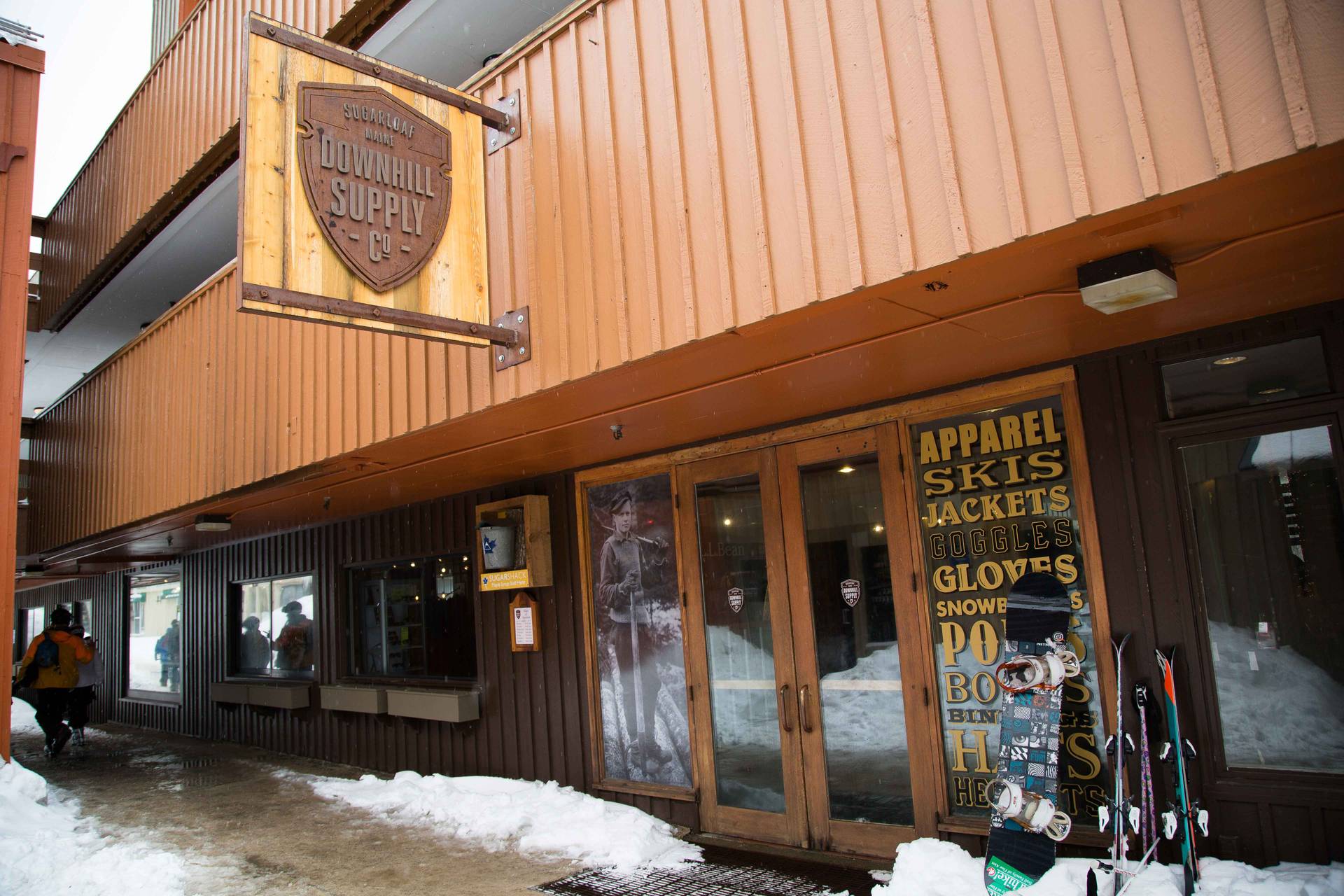 Downhill Supply Co storefront with snow piles