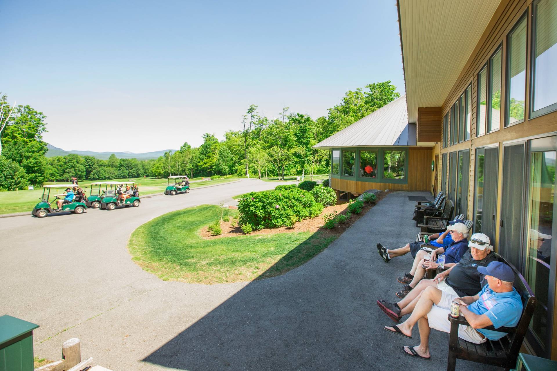 Golfers enjoying a beverage with a view from Stokes Bar and Grille