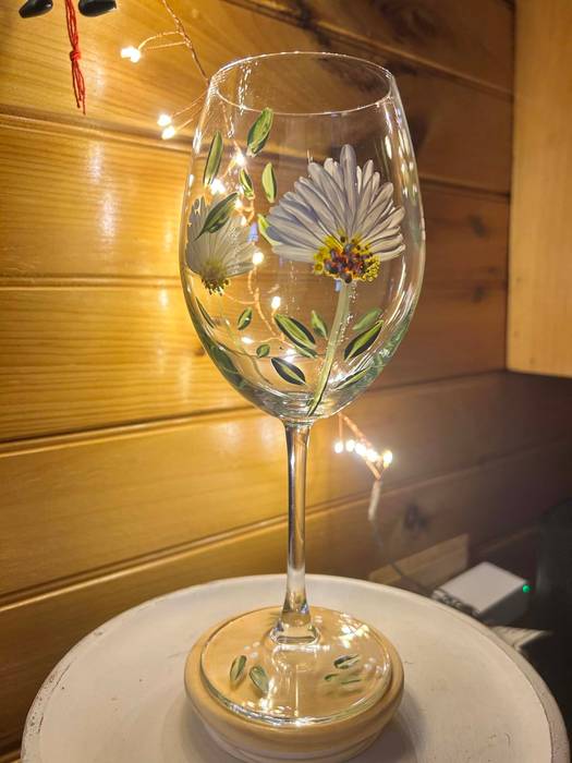 Decorated wine glass with flowers