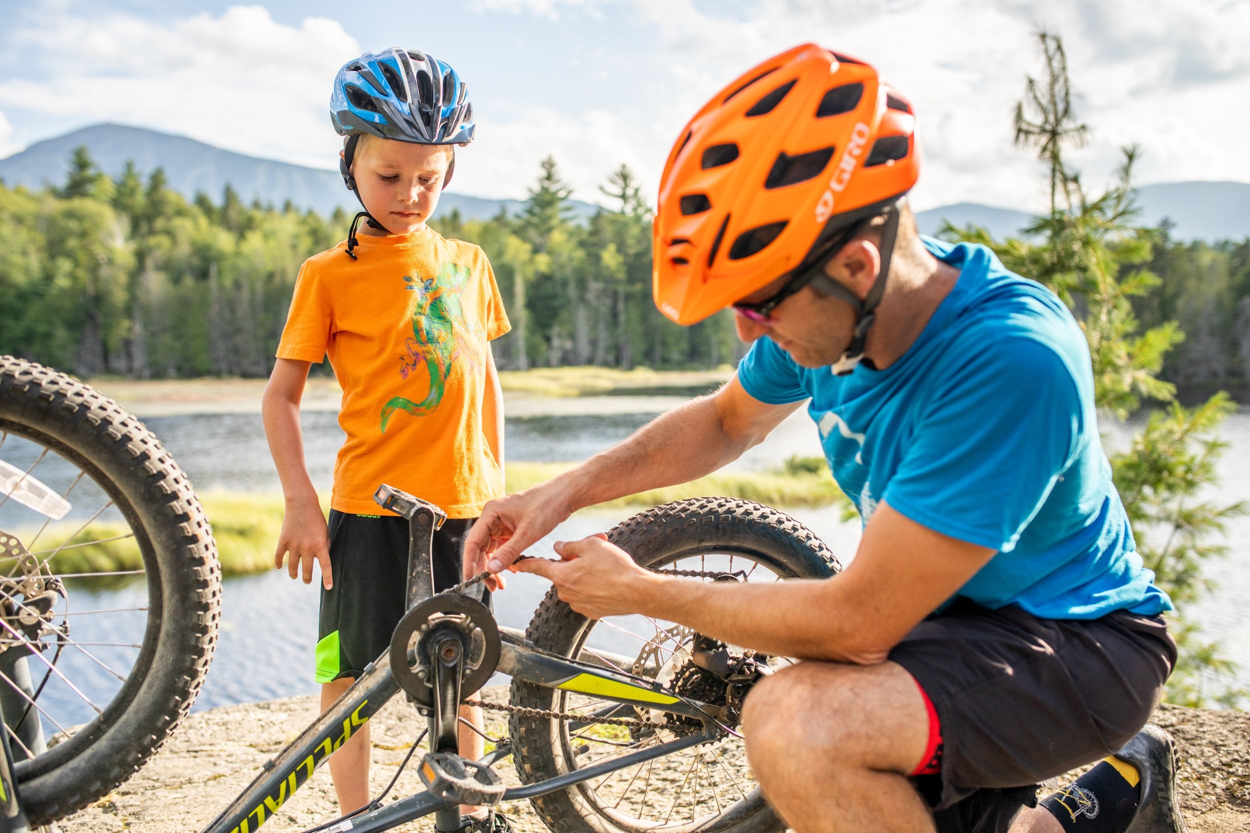 Father fixing child's bike