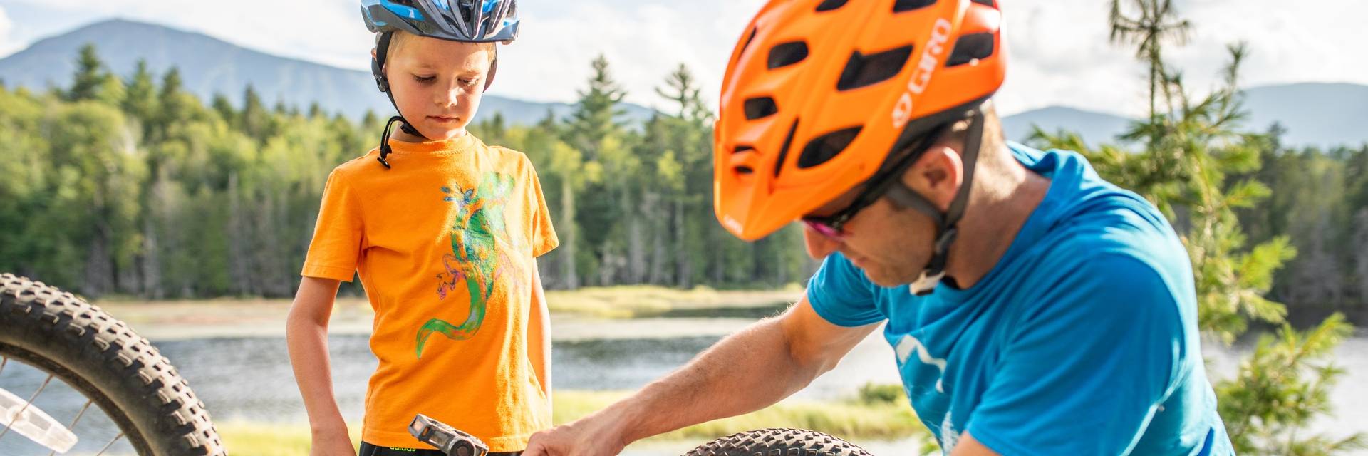 Father fixing child's bike