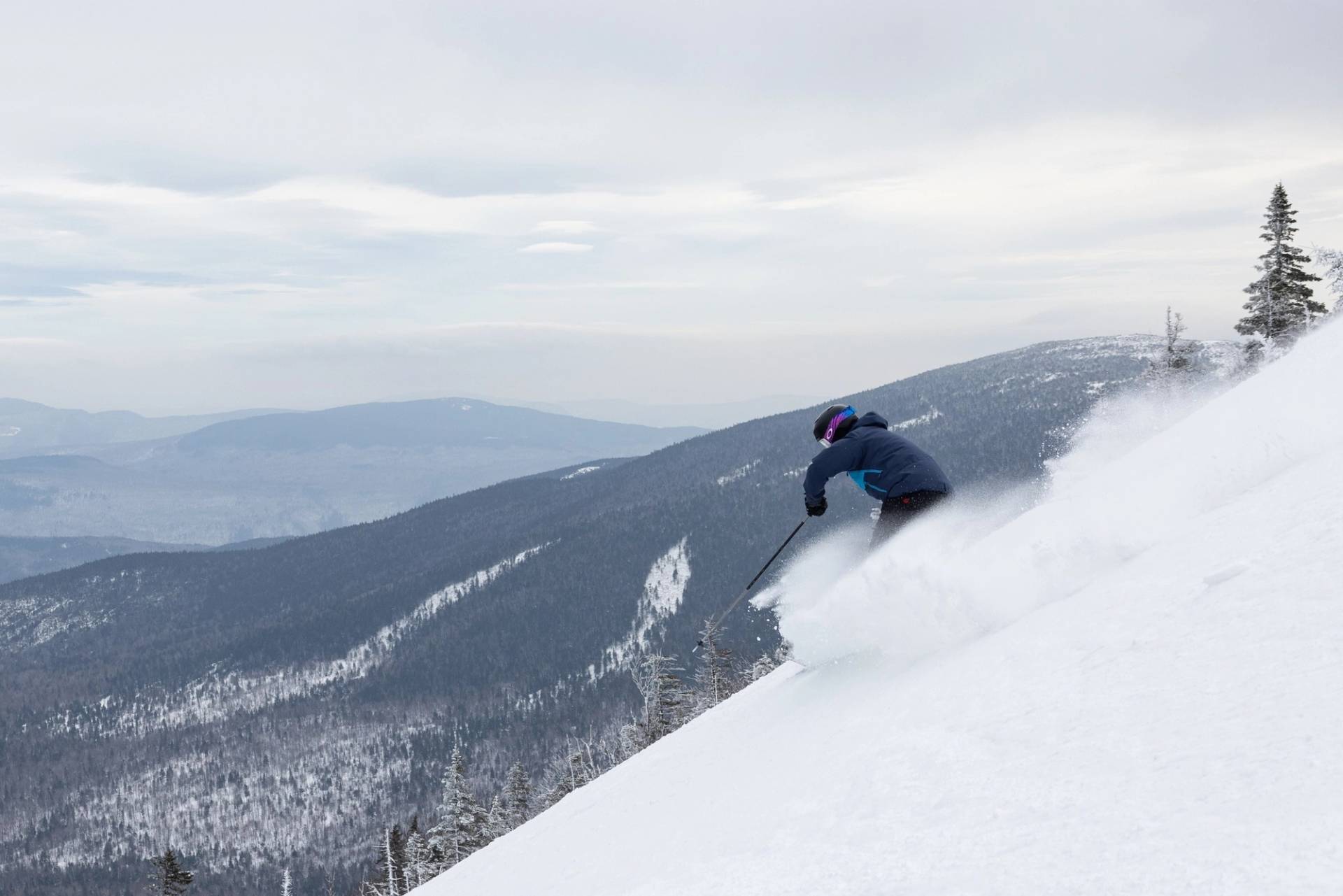skier on steep terrain