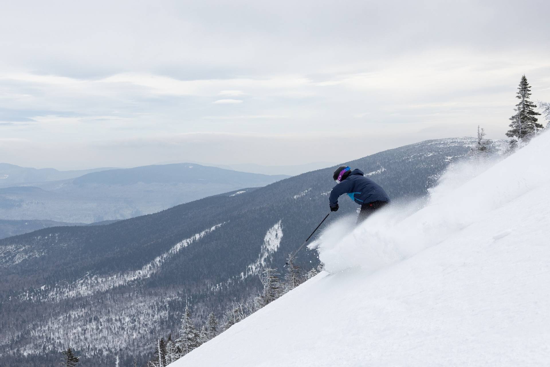skier on steep terrain