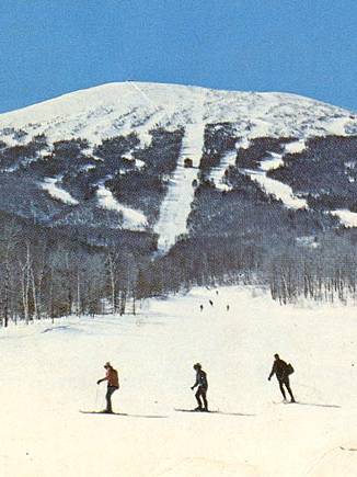 2 men sitting in snow