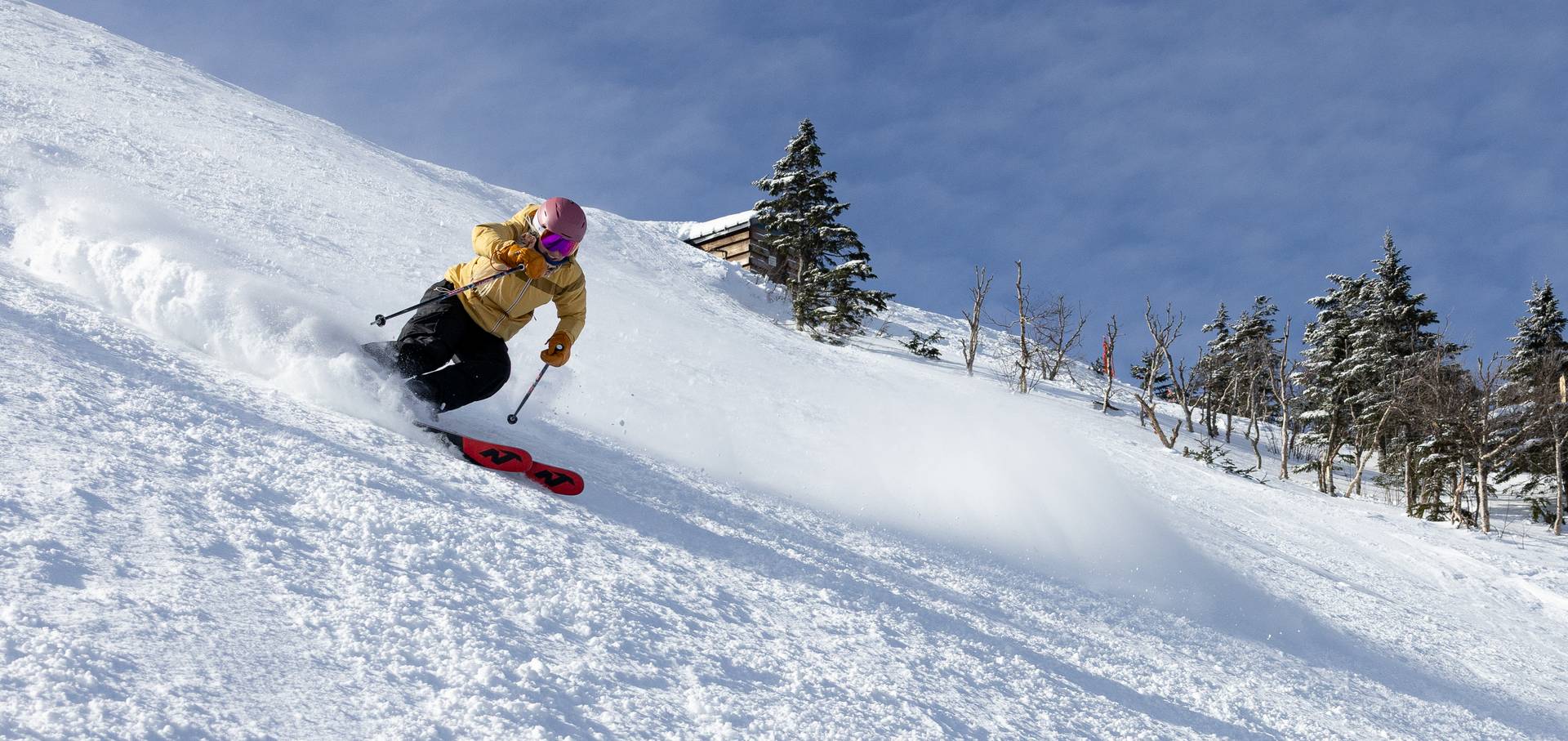 Snowboarder on steep terrain