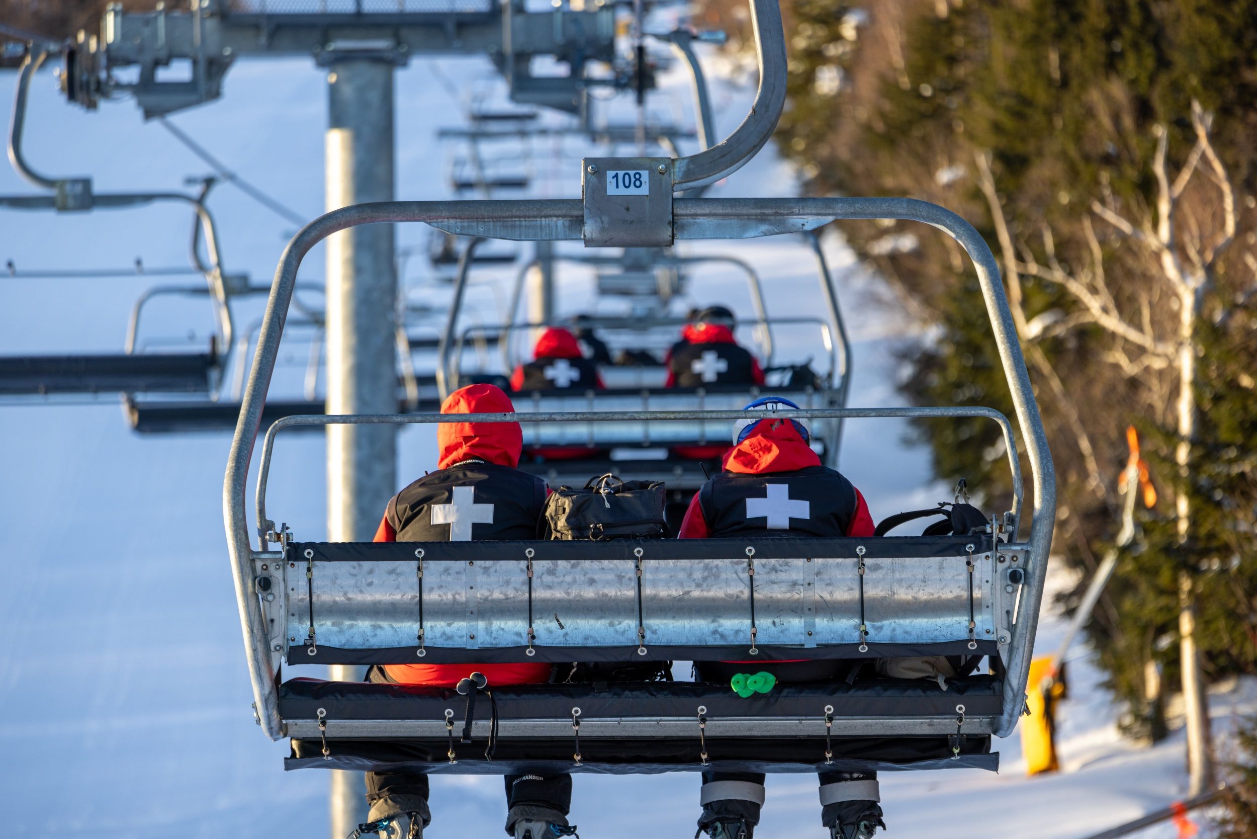 Ski patrol on chairlift