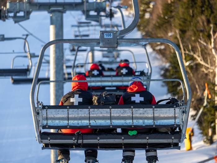 Ski patrol on chairlift