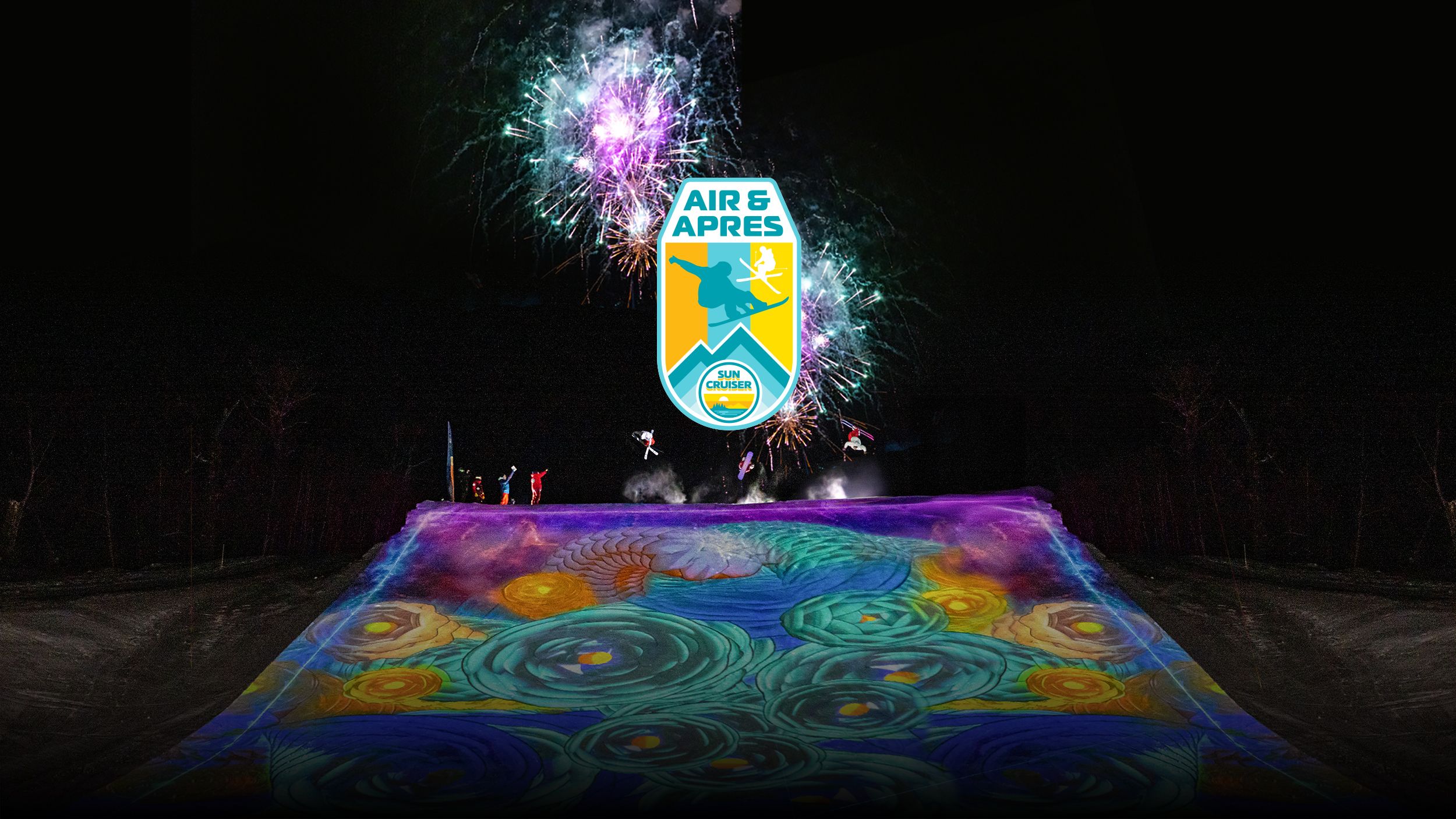 Snowboarder at the top of a large illuminated jump