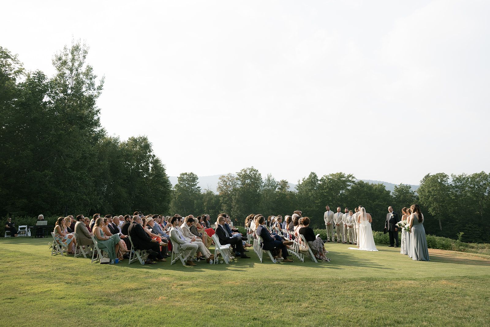Bride and groom with wedding attendees