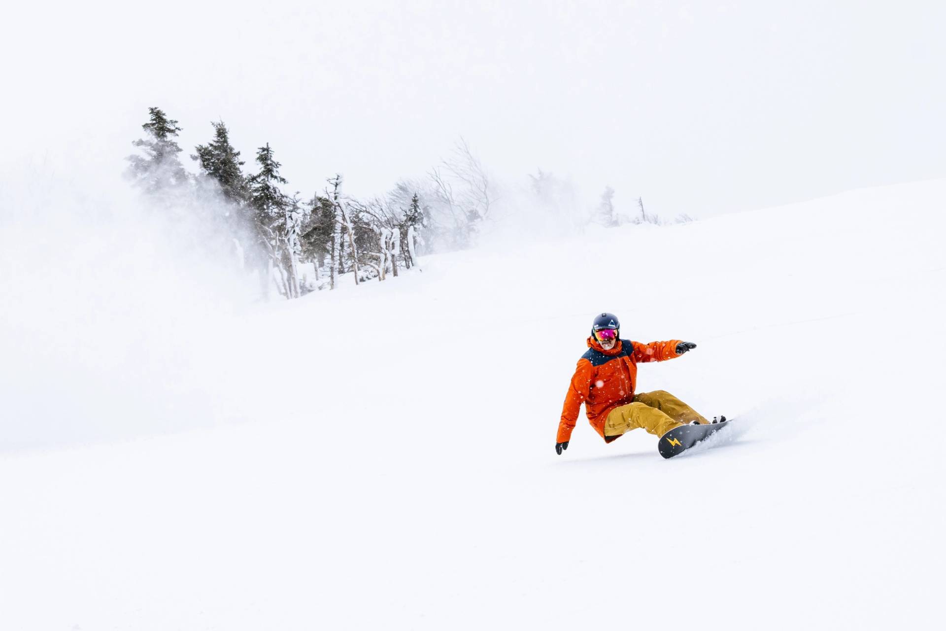 Snowboarder in white out snow
