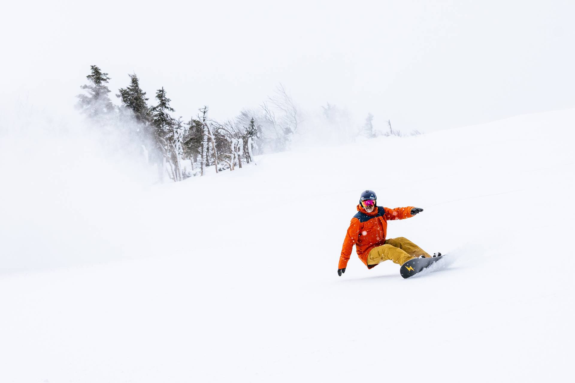 Snowboarder in white out snow