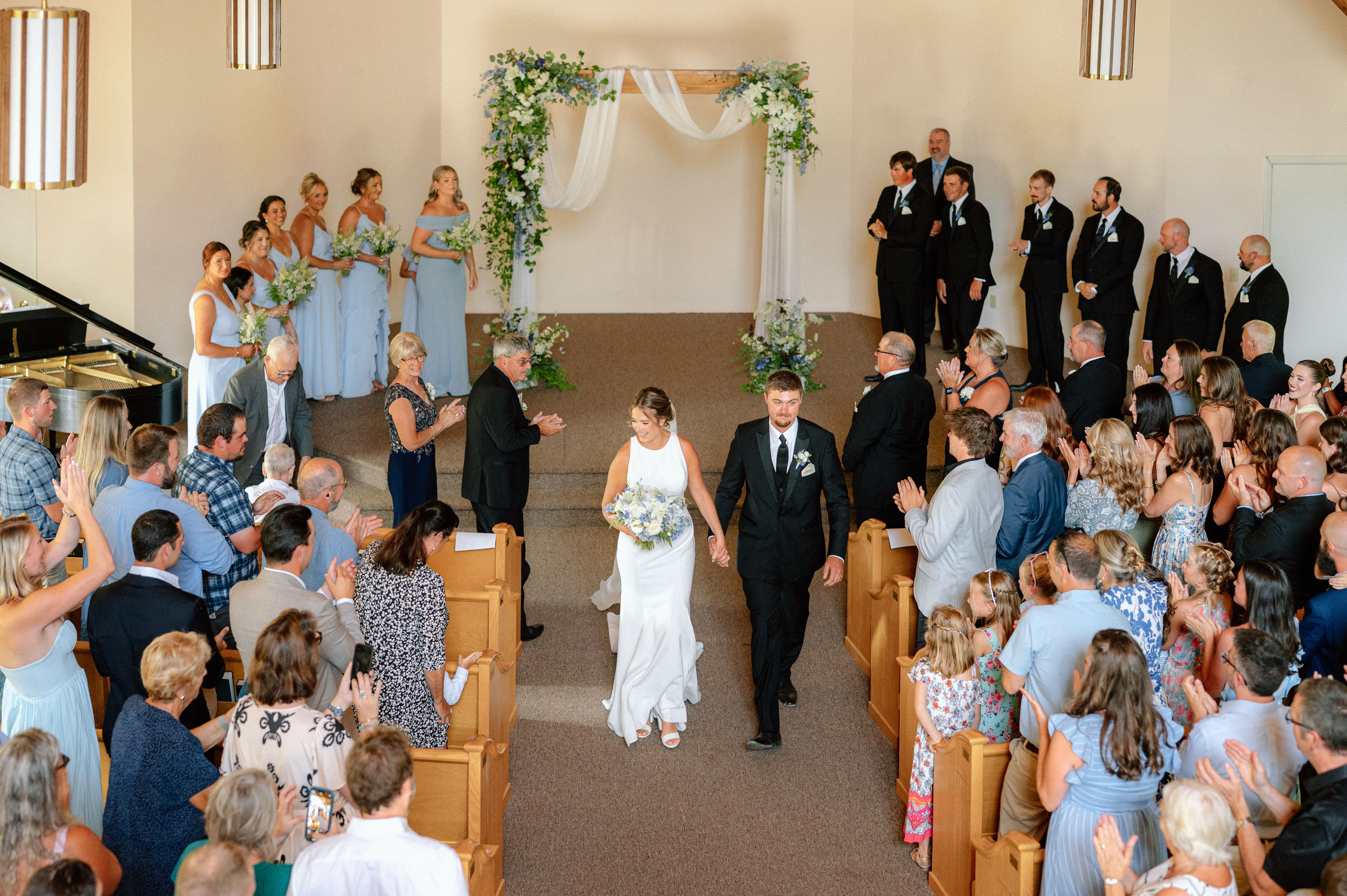 Bride and groom walking down the aisle
