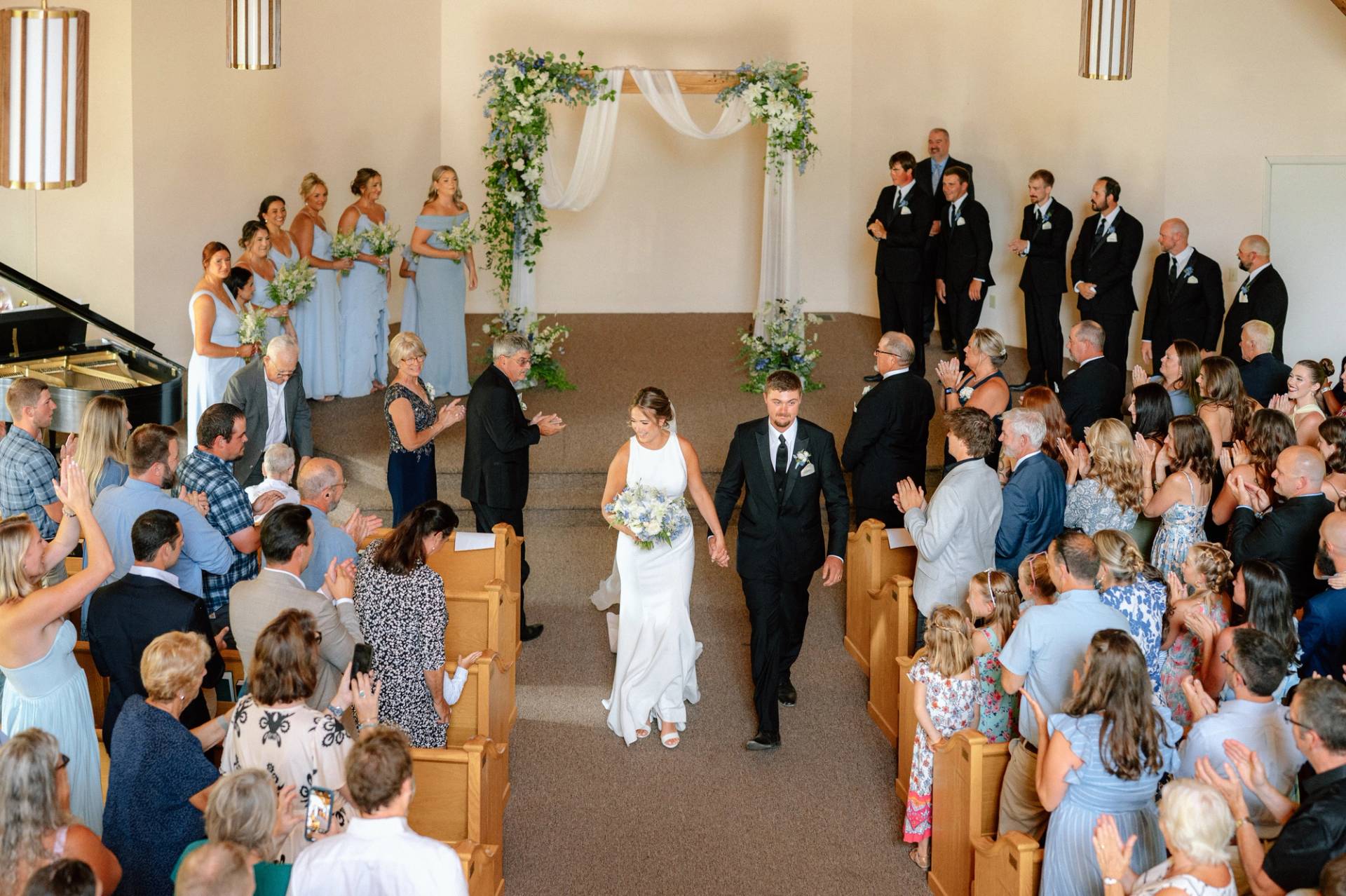 Bride and groom walking down the aisle