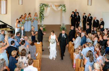 Bride and groom walking down the aisle