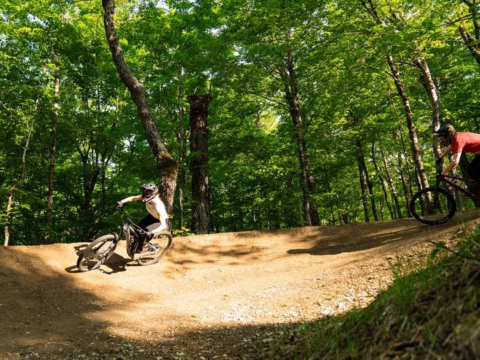 Two bikers on berm
