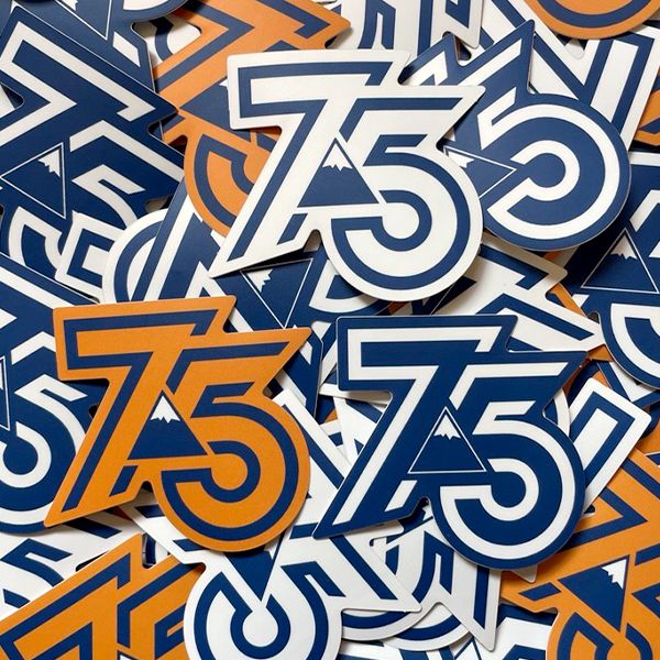 pile of Sugarloaf 75th Anniversary stickers