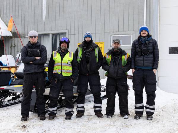 Snowmakers standing together
