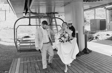 bride and groom unloading chairlift